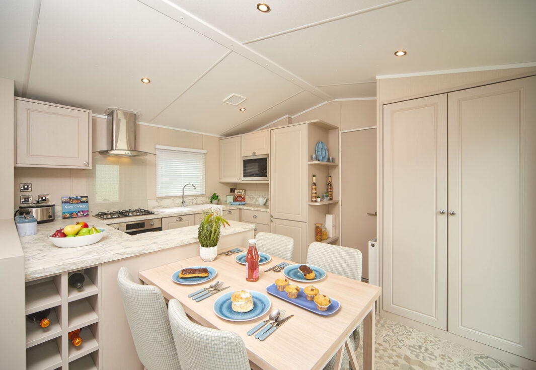 New Carnaby Lakehouse Lodge Static Caravan kitchen with dining table